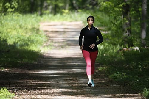 Jennifer Johnson jogging in a park